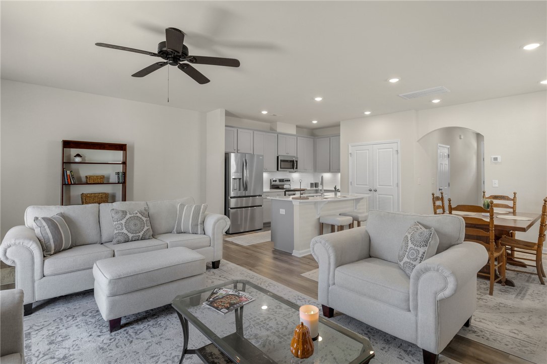 432 Bee Cv Way Pendleton, SC 29670 - Photo 16 of 39 Bright and open-concept living space seamlessly connects kitchen and dining areas.