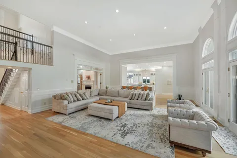 a living room with fireplace furniture and a flat screen tv