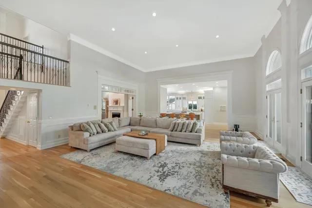 a living room with fireplace furniture and a flat screen tv