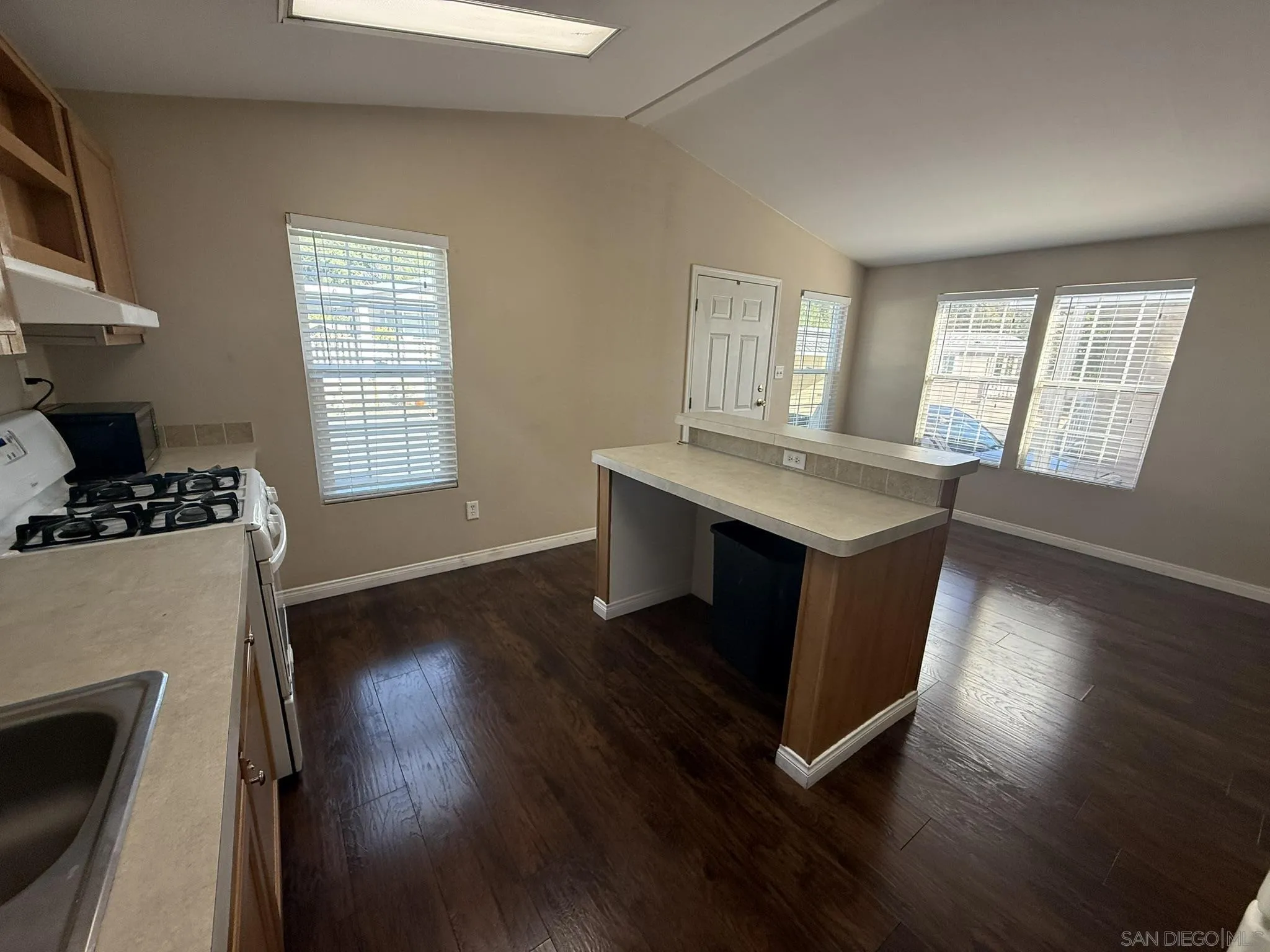 3505 Alpine Boulevard, Unit 49 Alpine, CA 91901 - Photo 8 of 31 a room with wooden floor and a fireplace