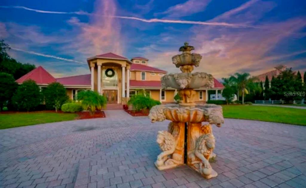 11715 Taylor Road Thonotosassa, FL 33592 - Photo 4 of 21 a front view of a house with garden equipment