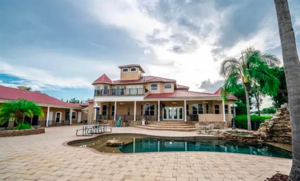 11715 Taylor Road Thonotosassa, FL 33592 - Photo 5 of 21 a front view of a house with swimming pool