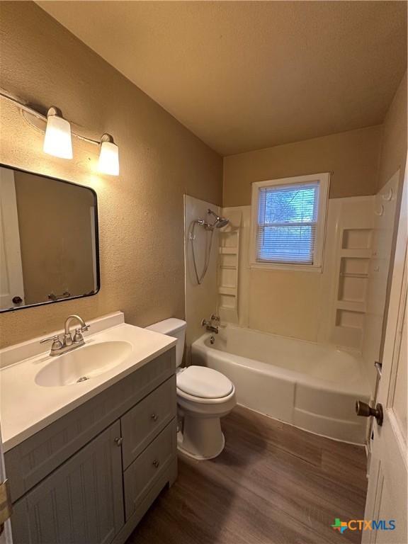505 Center Street Belton, TX 76513 - Photo 6 of 11 a bathroom with a toilet sink and mirror