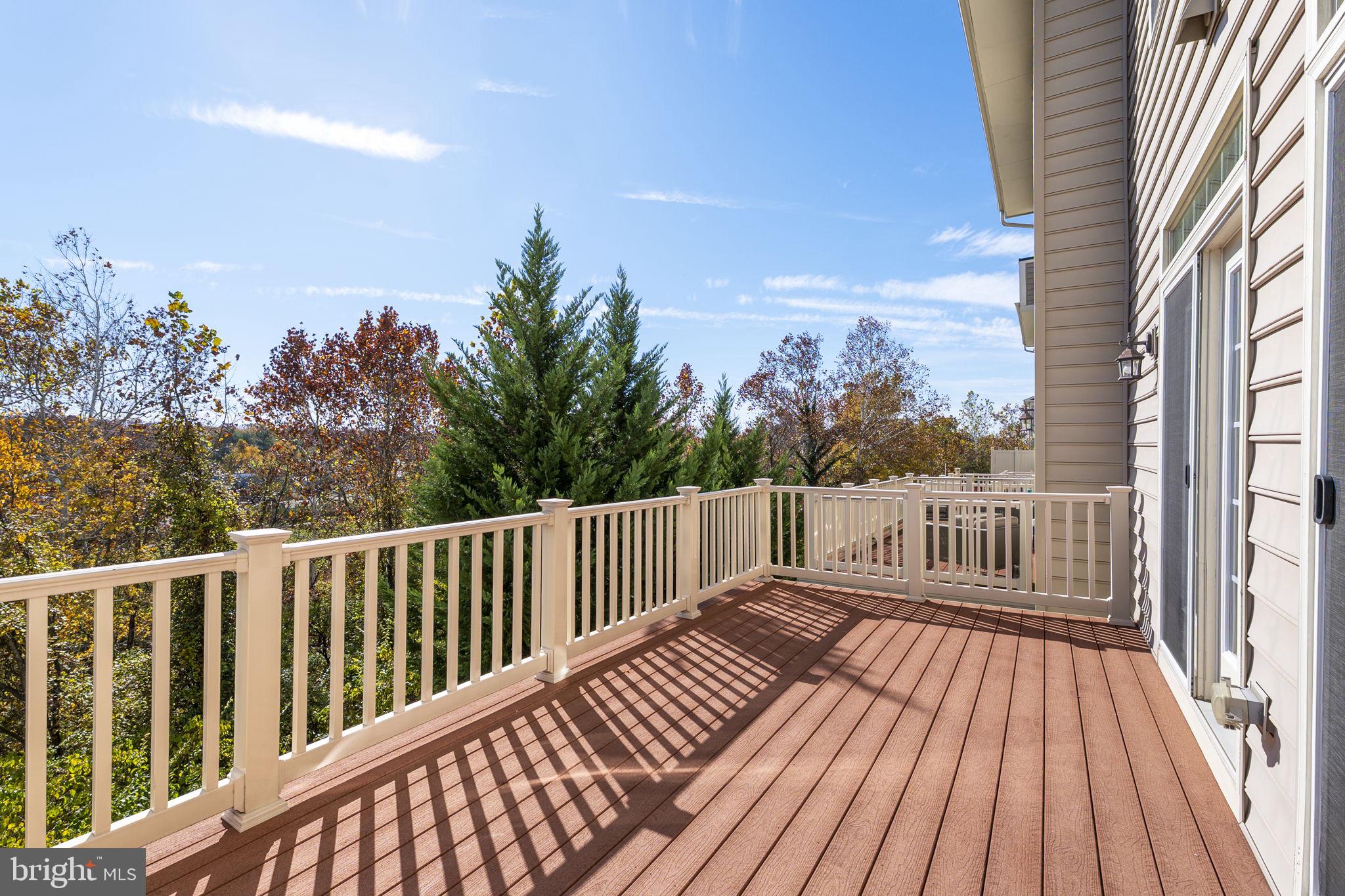 5313 Stream Bank Lane Greenbelt, MD 20770 - Photo 19 of 46 a balcony with wooden floor and fence