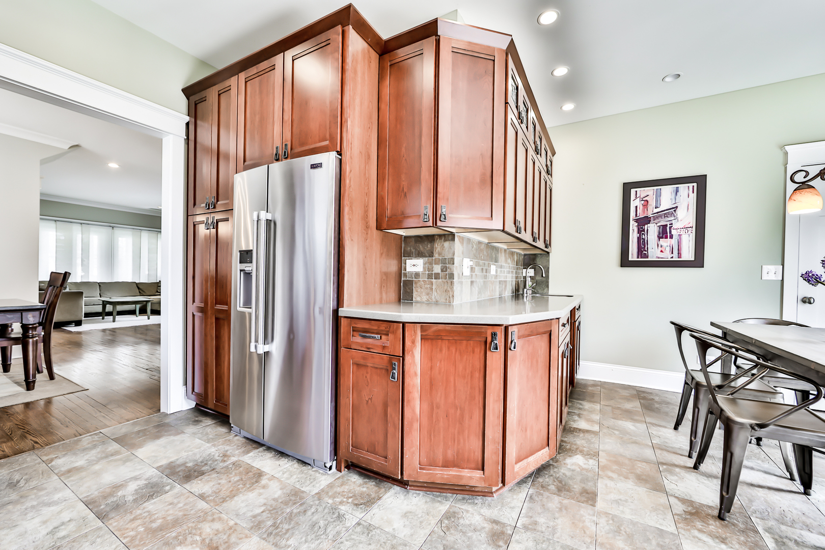 65 East Quincy Street Riverside, IL 60546 - Photo 16 of 49 a kitchen with stainless steel appliances granite countertop a refrigerator a stove and a sink with granite countertops