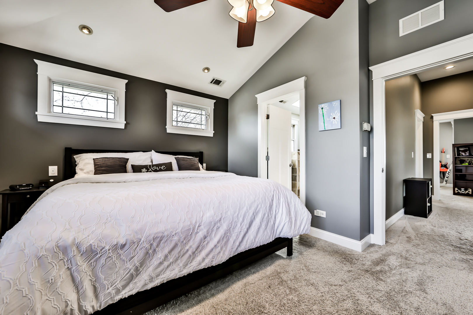 65 East Quincy Street Riverside, IL 60546 - Photo 21 of 49 a bedroom with a large bed and a chandelier