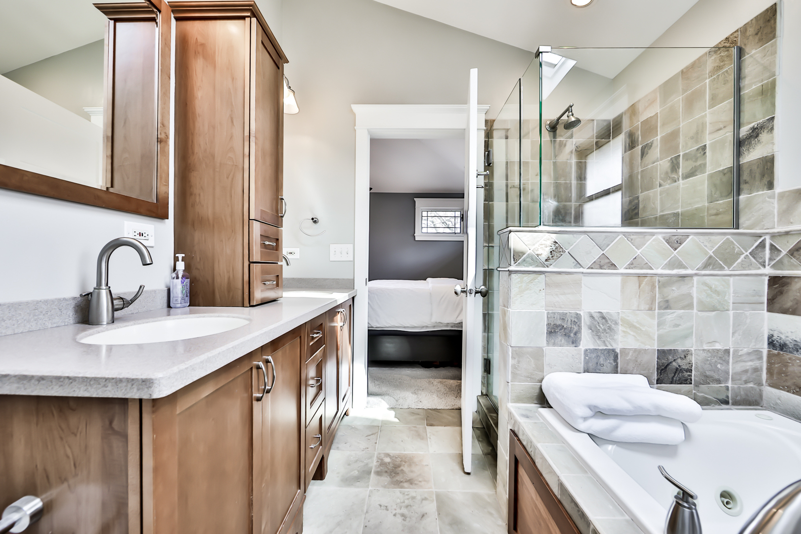 65 East Quincy Street Riverside, IL 60546 - Photo 24 of 49 a en suite bathroom with a sink and a mirror
