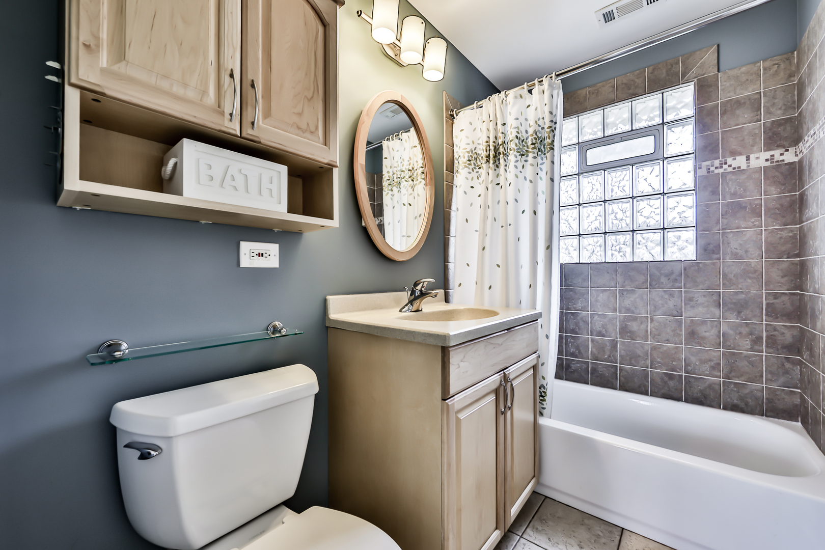 65 East Quincy Street Riverside, IL 60546 - Photo 28 of 49 a bathroom with a toilet sink and mirror