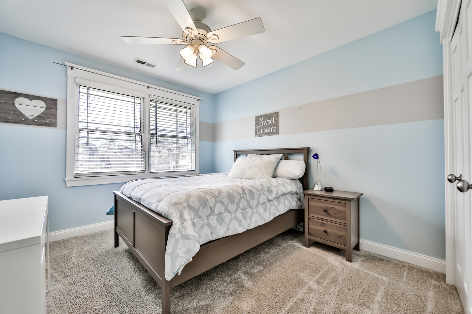 65 East Quincy Street Riverside, IL 60546 - Photo 29 of 49 a bedroom with a bed dresser and a window