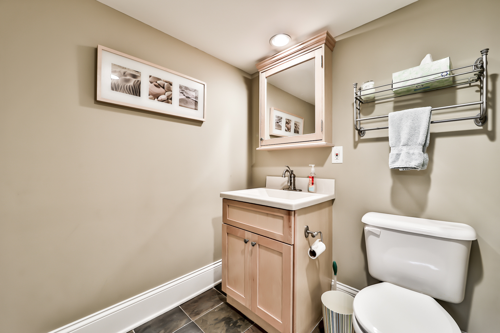 65 East Quincy Street Riverside, IL 60546 - Photo 33 of 49 a bathroom with a toilet a sink and mirror