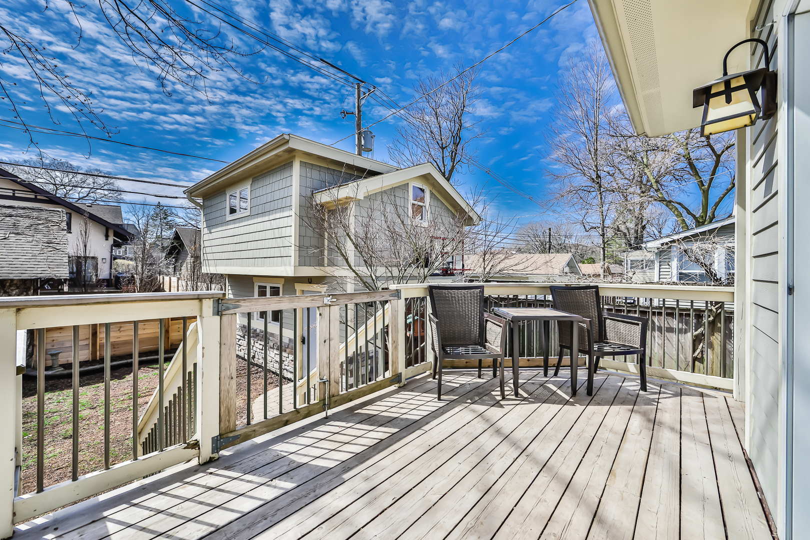 65 East Quincy Street Riverside, IL 60546 - Photo 39 of 49 a view of a roof deck with table and chairs a barbeque with wooden floor and fence