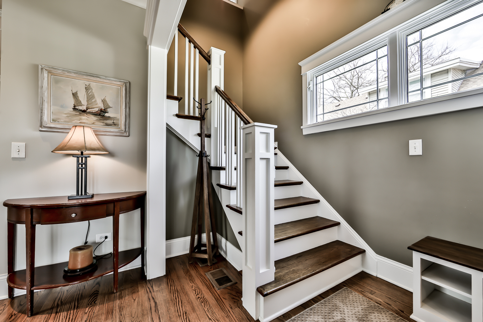65 East Quincy Street Riverside, IL 60546 - Photo 5 of 49 a view of entryway and hall with wooden floor
