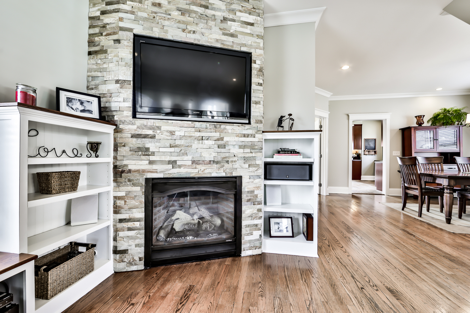 65 East Quincy Street Riverside, IL 60546 - Photo 9 of 49 a living room with furniture a flat screen tv and a fireplace