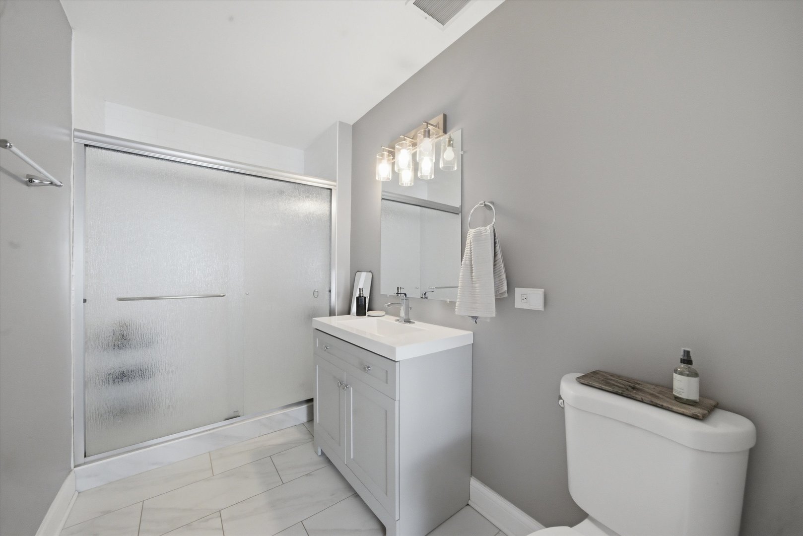 910 West Madison Street, Unit 803 Chicago, IL 60607 - Photo 10 of 15 a bathroom with a sink toilet and shower