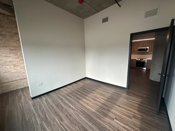 a view of livingroom with hardwood floor and a ceiling fan