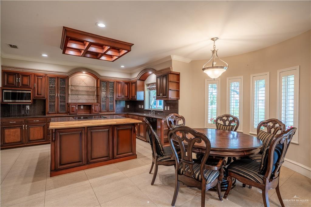 2013 Sabinal Street Mission, TX 78572 - Photo 11 of 33 a large kitchen with a table and chairs