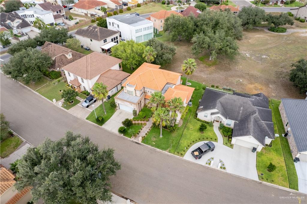 2013 Sabinal Street Mission, TX 78572 - Photo 4 of 33 an aerial view of a house with a yard and lake view
