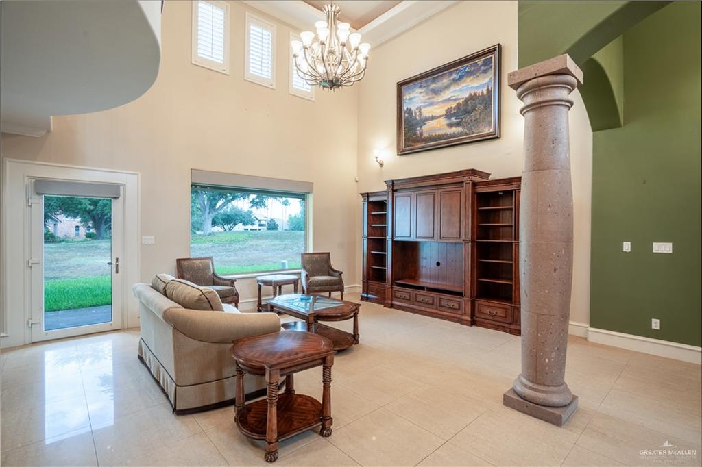 2013 Sabinal Street Mission, TX 78572 - Photo 6 of 33 a living room with furniture a chandelier and a window