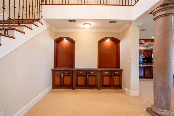 a view of a livingroom with furniture and staircase