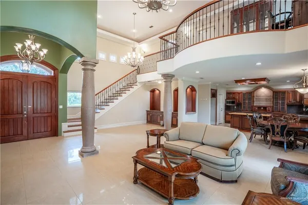 a living room with furniture ceiling fan and a rug