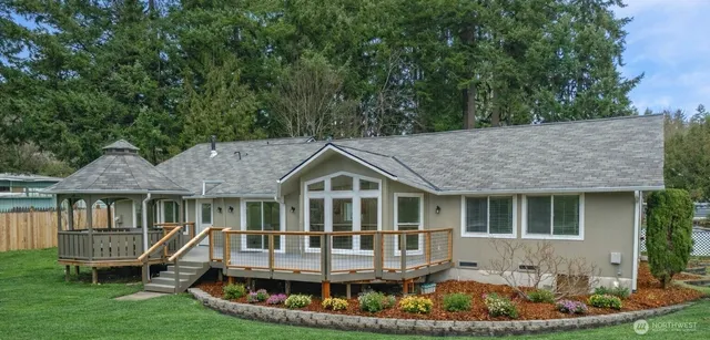 a front view of a house with a yard table and chairs