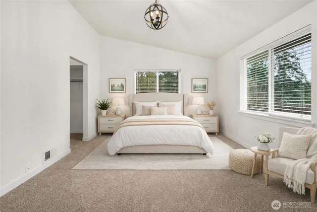 a bedroom with bed and a window