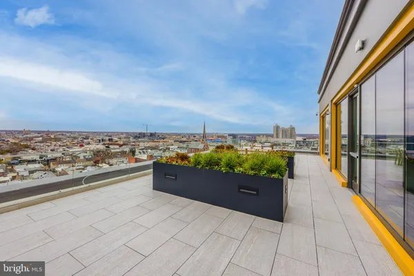 a view of a terrace with furniture and garden view