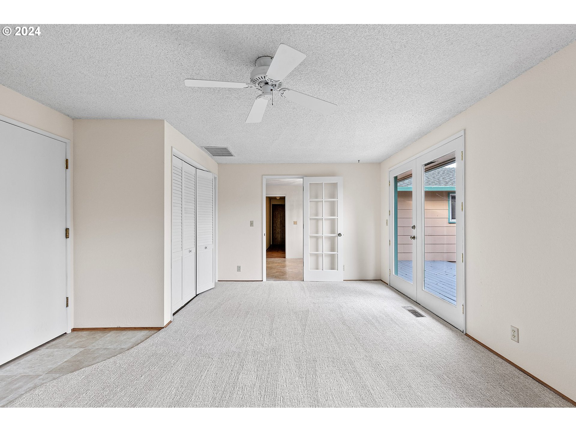 609 Rowan Avenue Springfield, OR 97477 - Photo 15 of 32 a view of an empty room with wooden floor