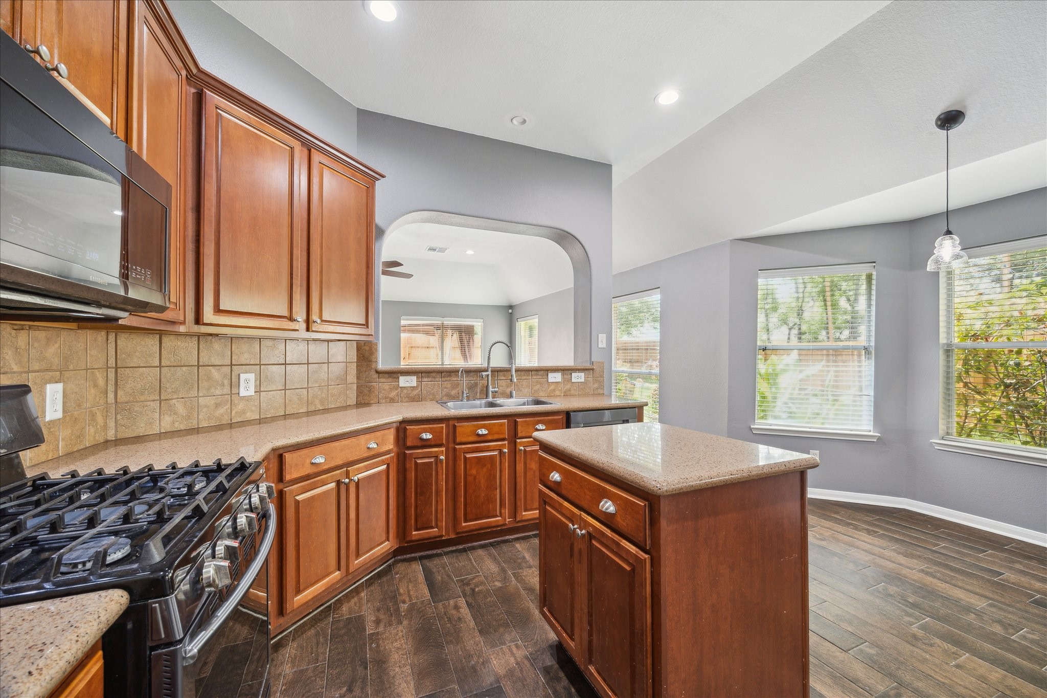 20910 Sandy Briar Court Spring, TX 77379 - Photo 14 of 28 a kitchen with stainless steel appliances granite countertop a sink stove and cabinets