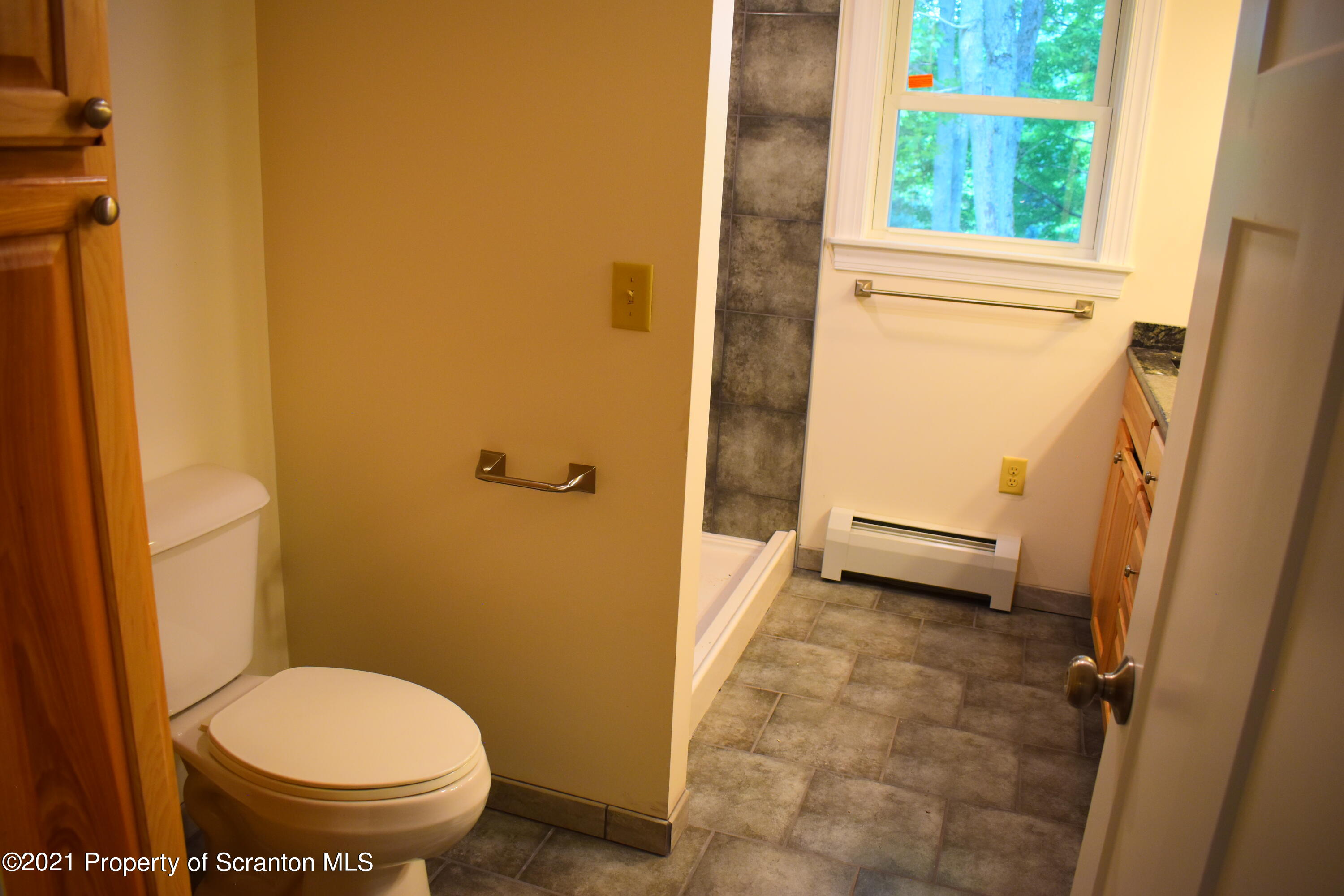 104 Airport Road Hallstead, PA 18822 - Photo 27 of 50 a bathroom with a toilet and a shower