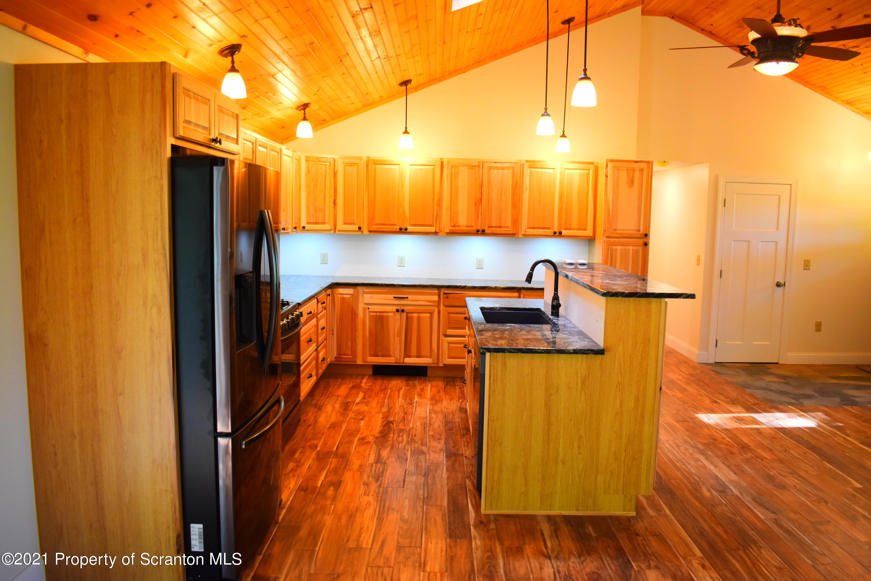 104 Airport Road Hallstead, PA 18822 - Photo 8 of 50 a kitchen view with wooden floor and a sink