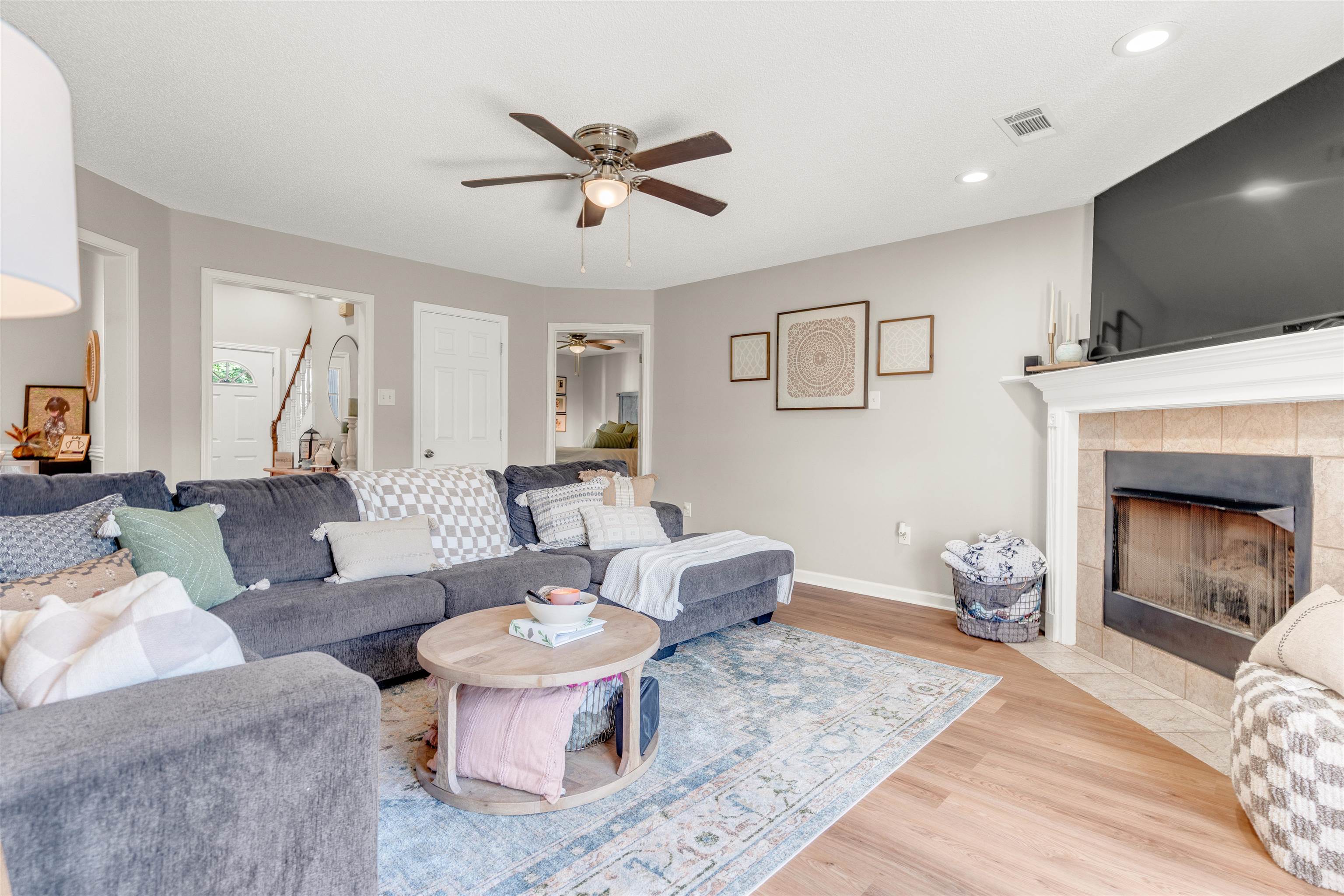 126 Buck Stand Road Atoka, TN 38004 - Photo 11 of 21 Living area with ceiling fan, wood finished floors, a fireplace, baseboards, and recessed lighting