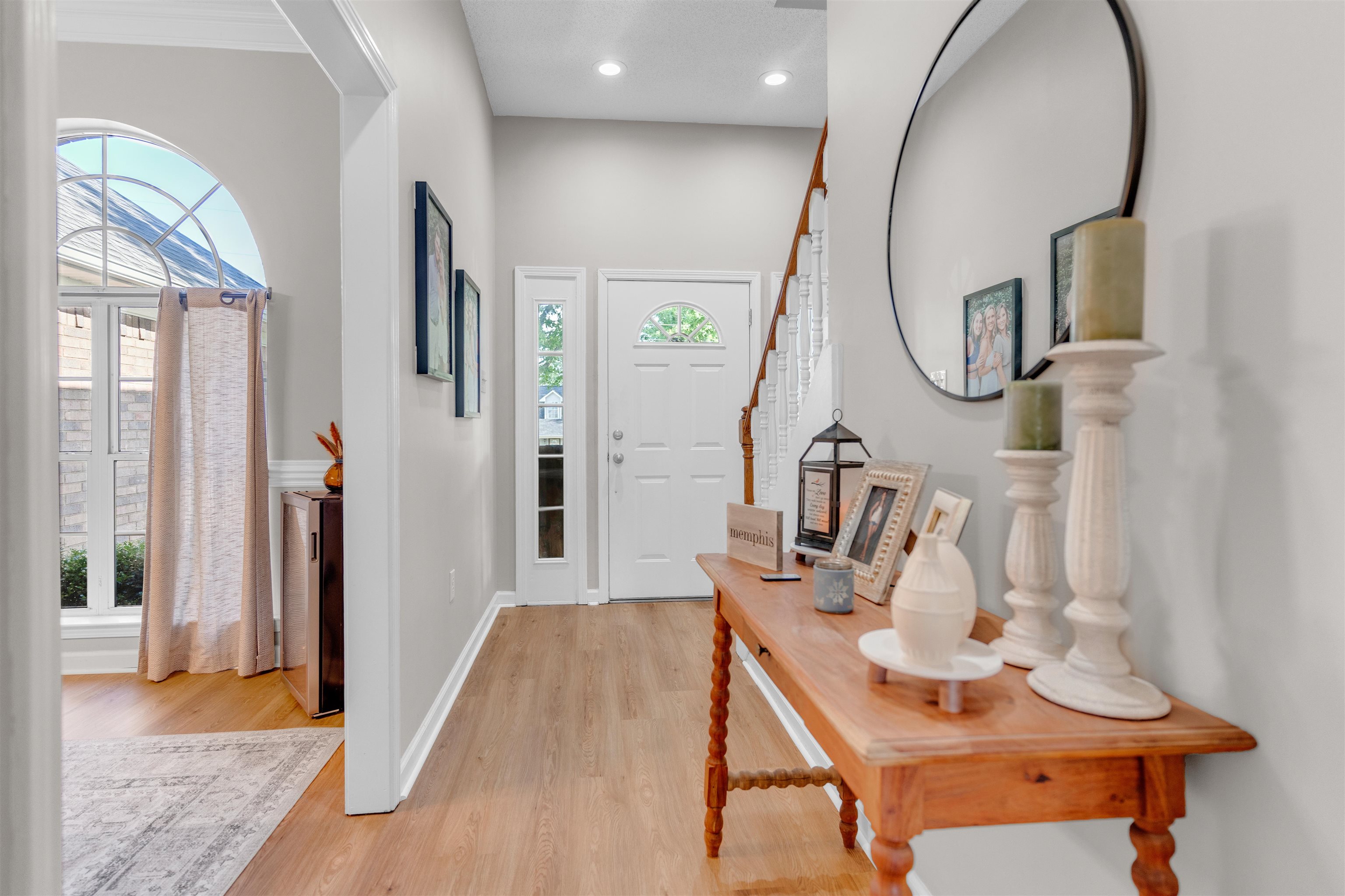 Entrance foyer with healthy amount of natural light, light wood-type flooring, baseboards, and recessed lighting