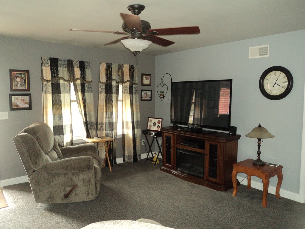621 Detroit Street Fall River, MA 02721 - Photo 4 of 23 a living room with furniture a flat screen tv and a window