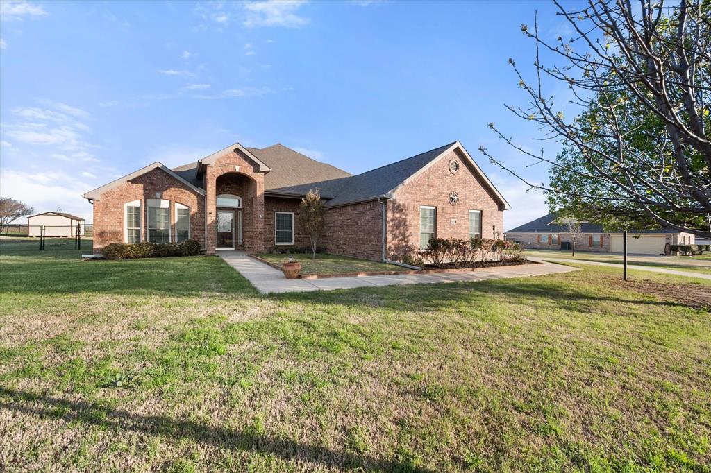10929 Soft Shell Drive Venus, TX 76084 - Photo 1 of 39 a view of a house with a big yard and large trees