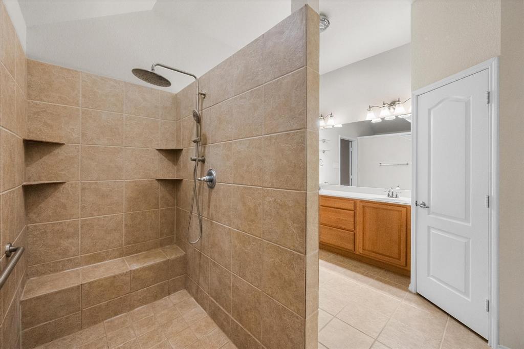 10929 Soft Shell Drive Venus, TX 76084 - Photo 13 of 39 a bathroom with a shower and a sink