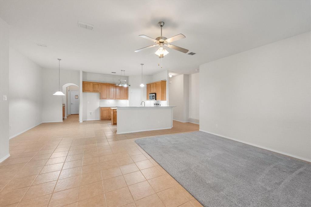 10929 Soft Shell Drive Venus, TX 76084 - Photo 16 of 39 a view of a kitchen with cabinet and a ceiling fan