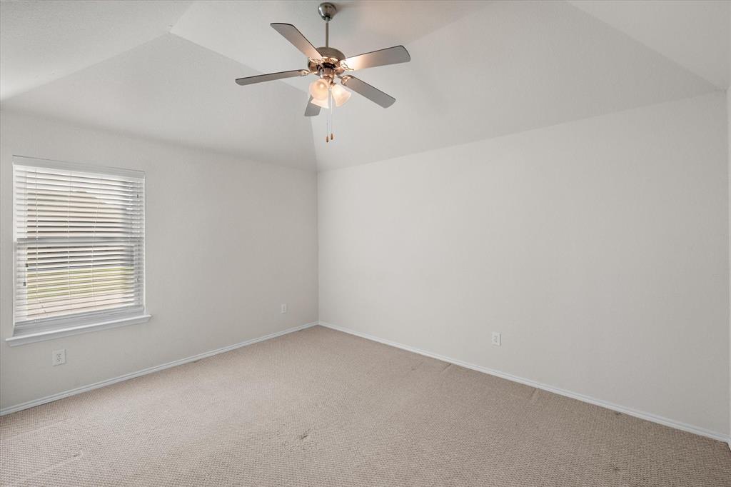 10929 Soft Shell Drive Venus, TX 76084 - Photo 27 of 39 an empty room with a window and a fan