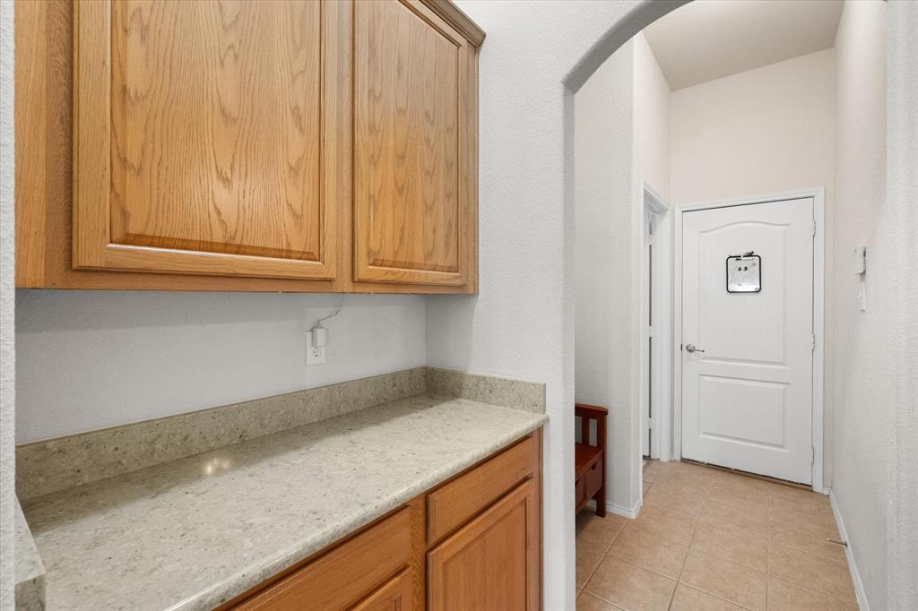 10929 Soft Shell Drive Venus, TX 76084 - Photo 31 of 39 a kitchen with a sink and cabinets