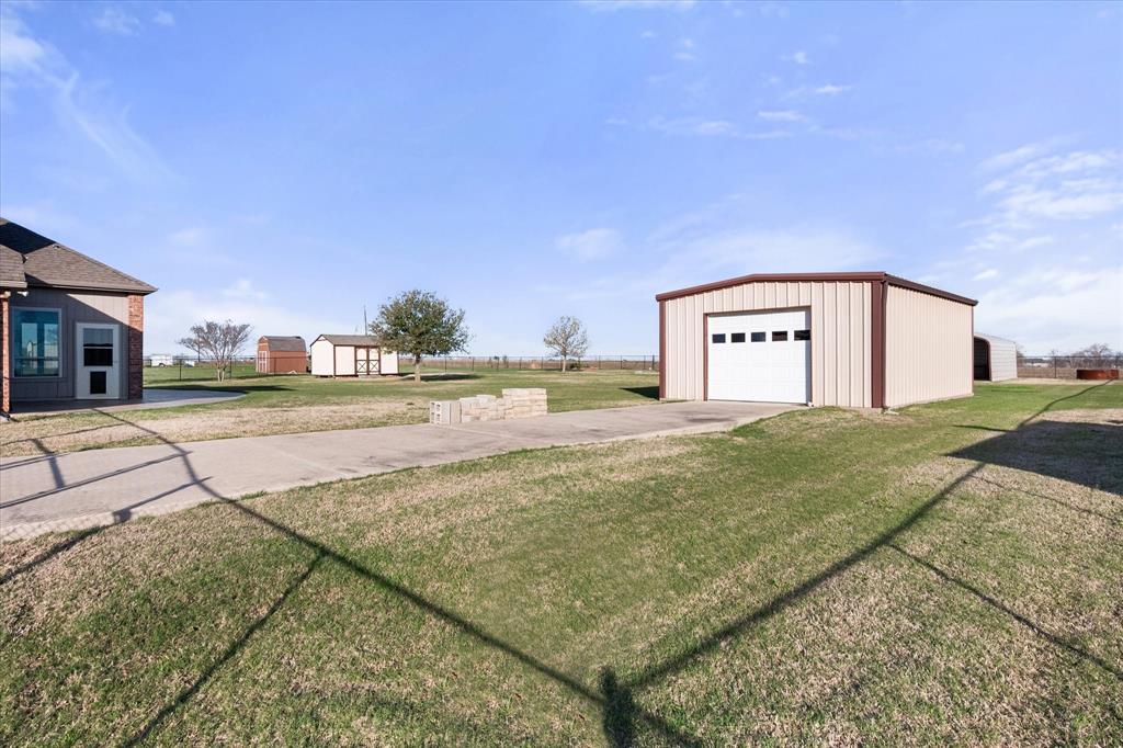 10929 Soft Shell Drive Venus, TX 76084 - Photo 35 of 39 a view of a big room with a yard