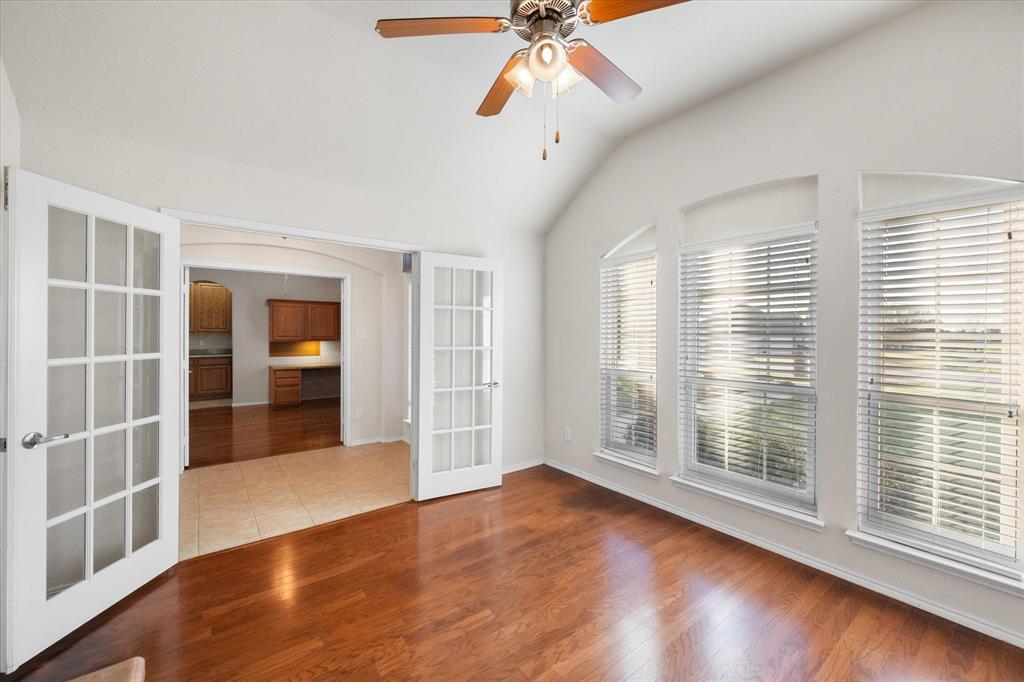 10929 Soft Shell Drive Venus, TX 76084 - Photo 6 of 39 a view of an empty room with a window and wooden floor