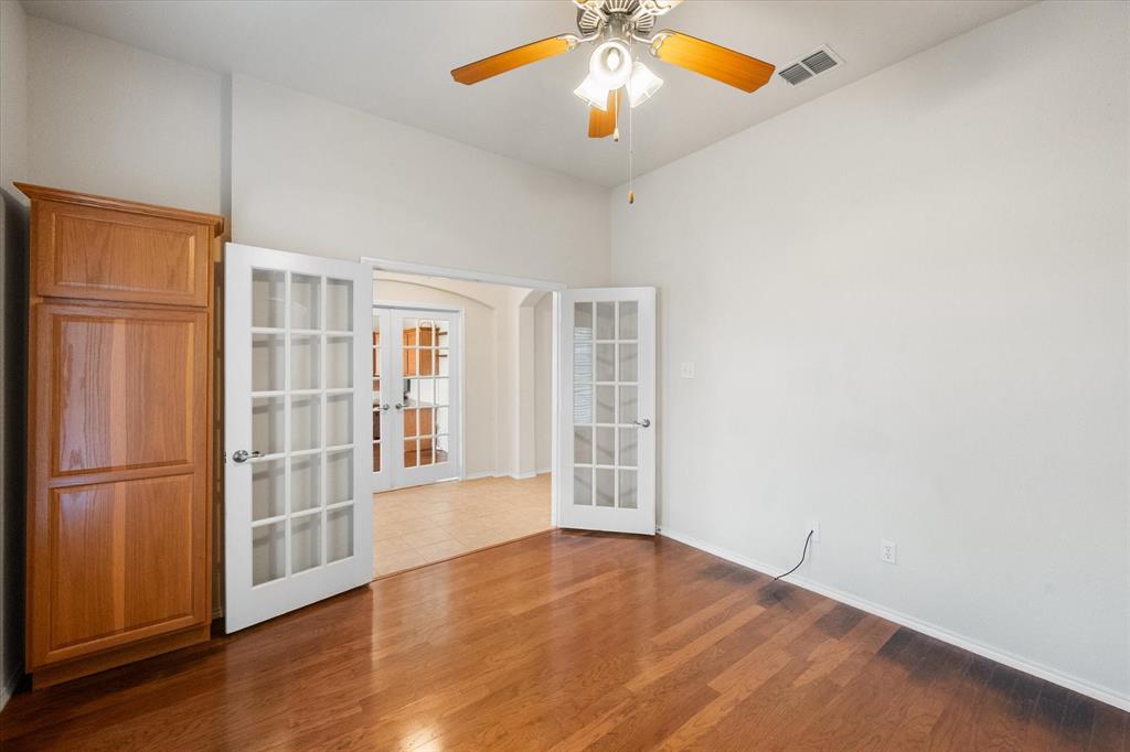 10929 Soft Shell Drive Venus, TX 76084 - Photo 8 of 39 an empty room with wooden floor closet and windows