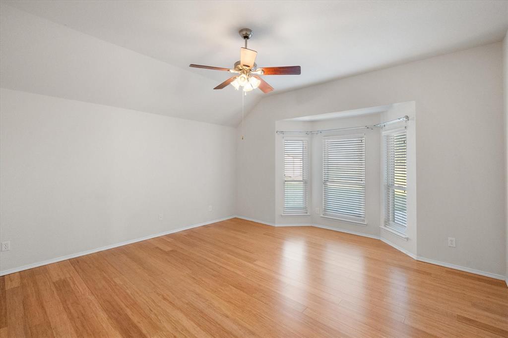 10929 Soft Shell Drive Venus, TX 76084 - Photo 10 of 39 a view of empty room with wooden floor and fan