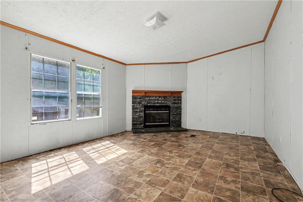249 John Golden Road Temple, GA 30179 - Photo 23 of 45 a view of empty room with a fireplace