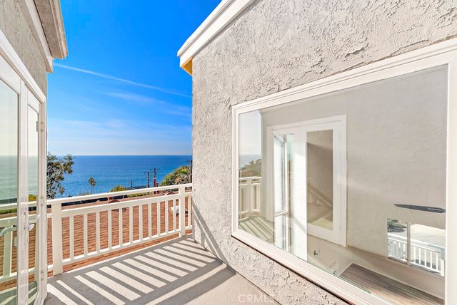 a view of a balcony with wooden floor