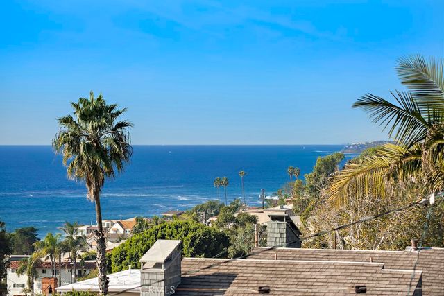 a view of a yard and ocean view
