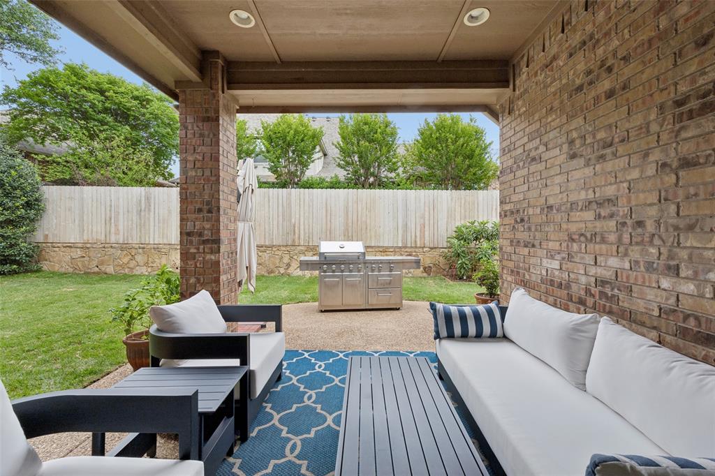 1608 Tuscan Ridge Circle Southlake, TX 76092 - Photo 31 of 36 a view of a patio with couches chairs and a yard