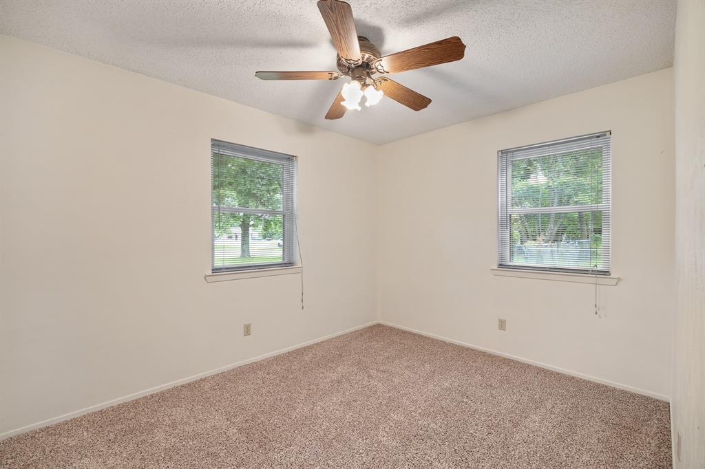 24264 State Highway Canton, TX 75103 - Photo 14 of 38 an empty room with a window and a fan