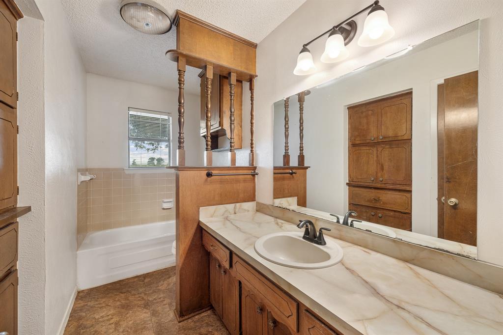 24264 State Highway Canton, TX 75103 - Photo 15 of 38 a bathroom with a sink and a mirror