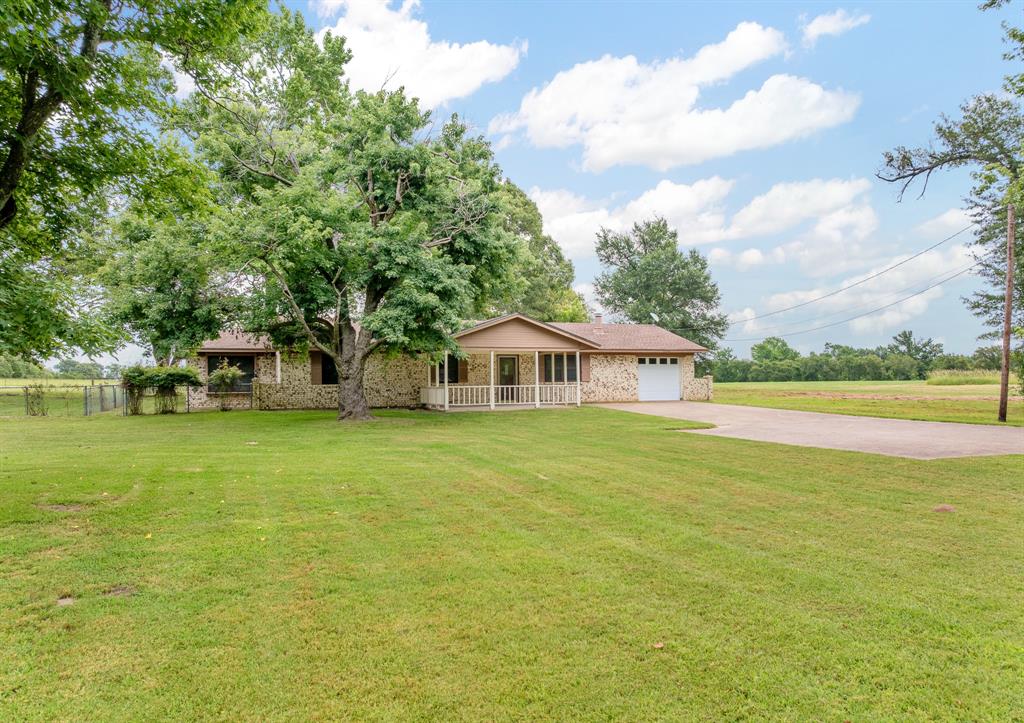 24264 State Highway Canton, TX 75103 - Photo 2 of 38 a front view of a house with a garden